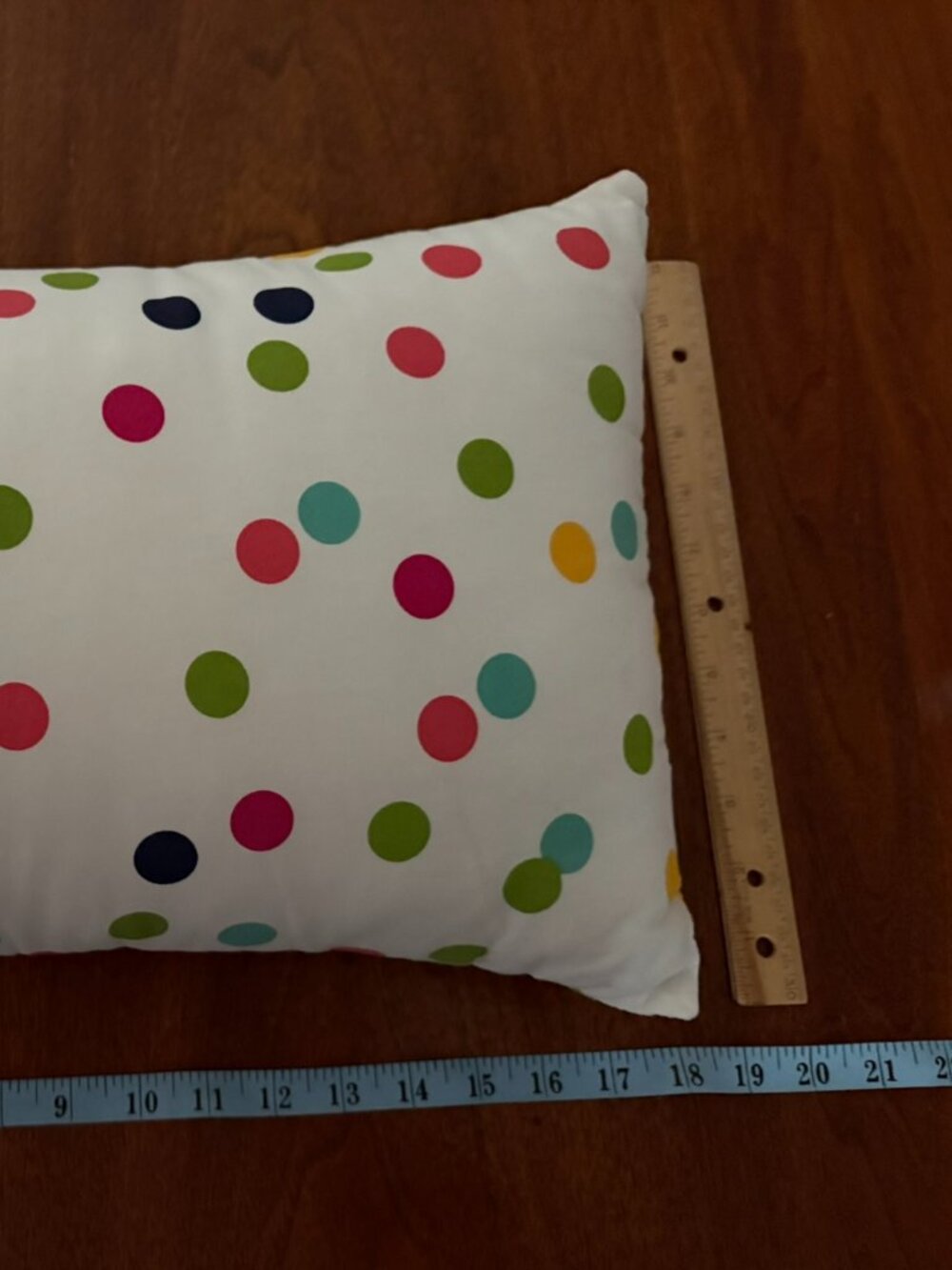 Decorative pillow with white polka dotted removable case